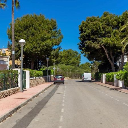 Bonito apartamento con terraza, jardín y piscina Cala'N Bosch  Exterior foto